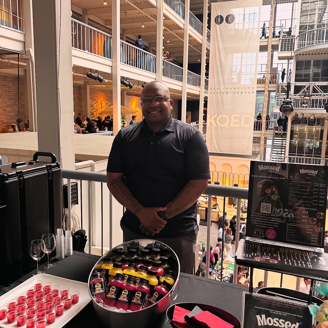 Mossed Juicery founder Darren Oyobio at the booth with cold-pressed juice and samples